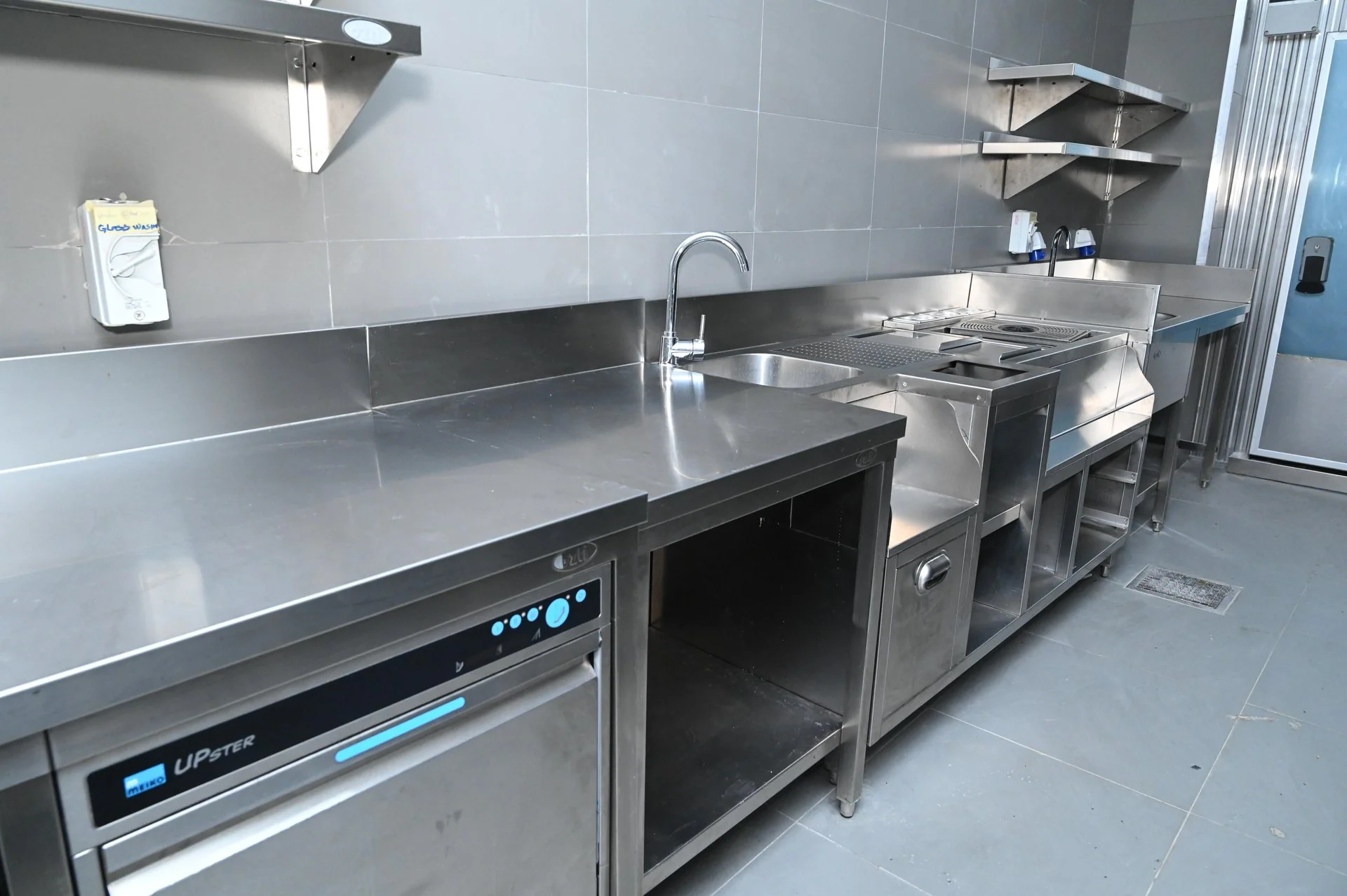Commercial pre-rinse tap and stainless sink installation