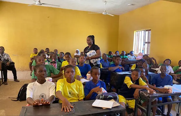 Students gathered in a classroom.