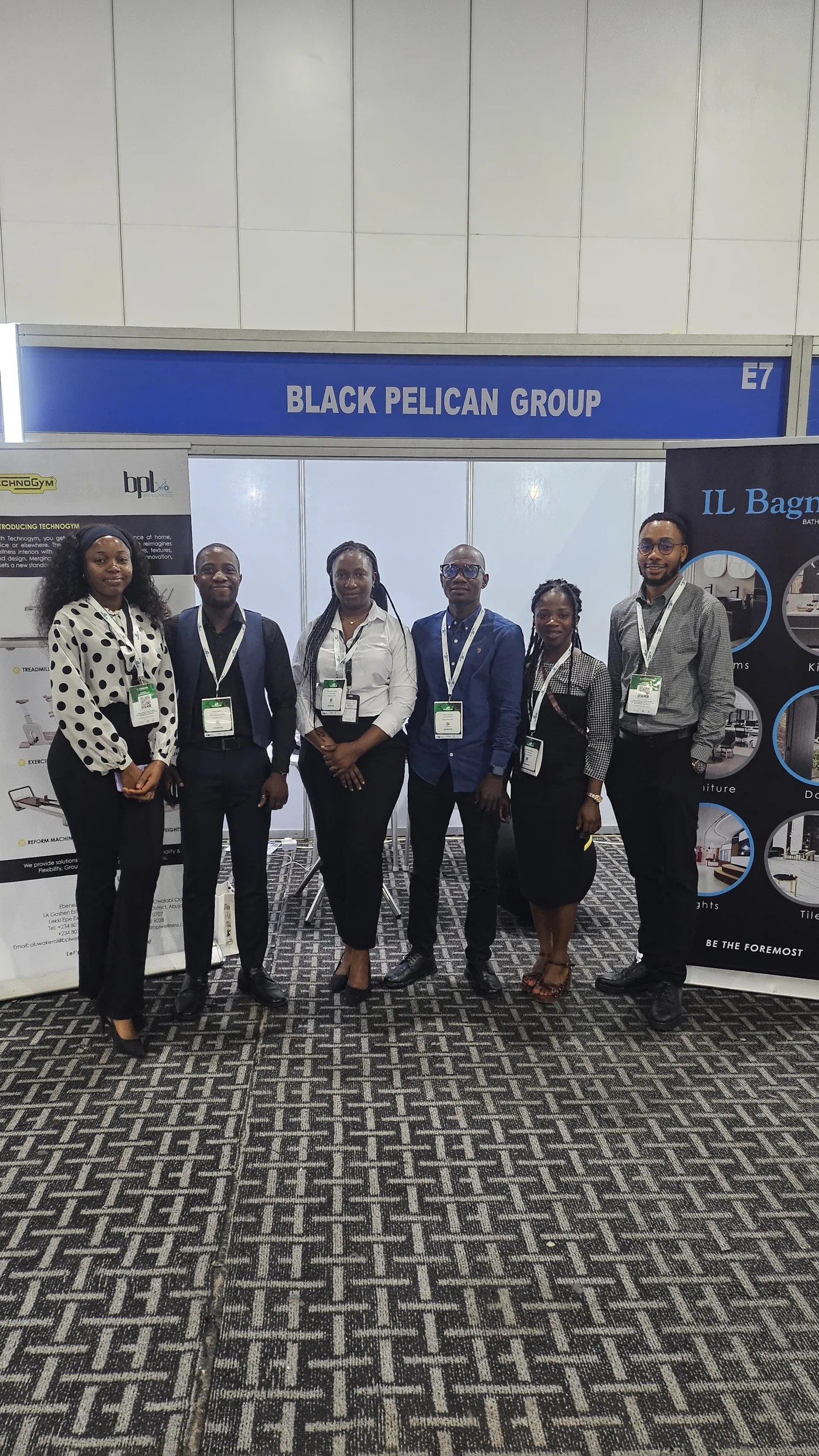 Group representatives posing at the exhibition